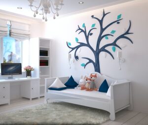 Empty children's bedroom with tree art on wall
